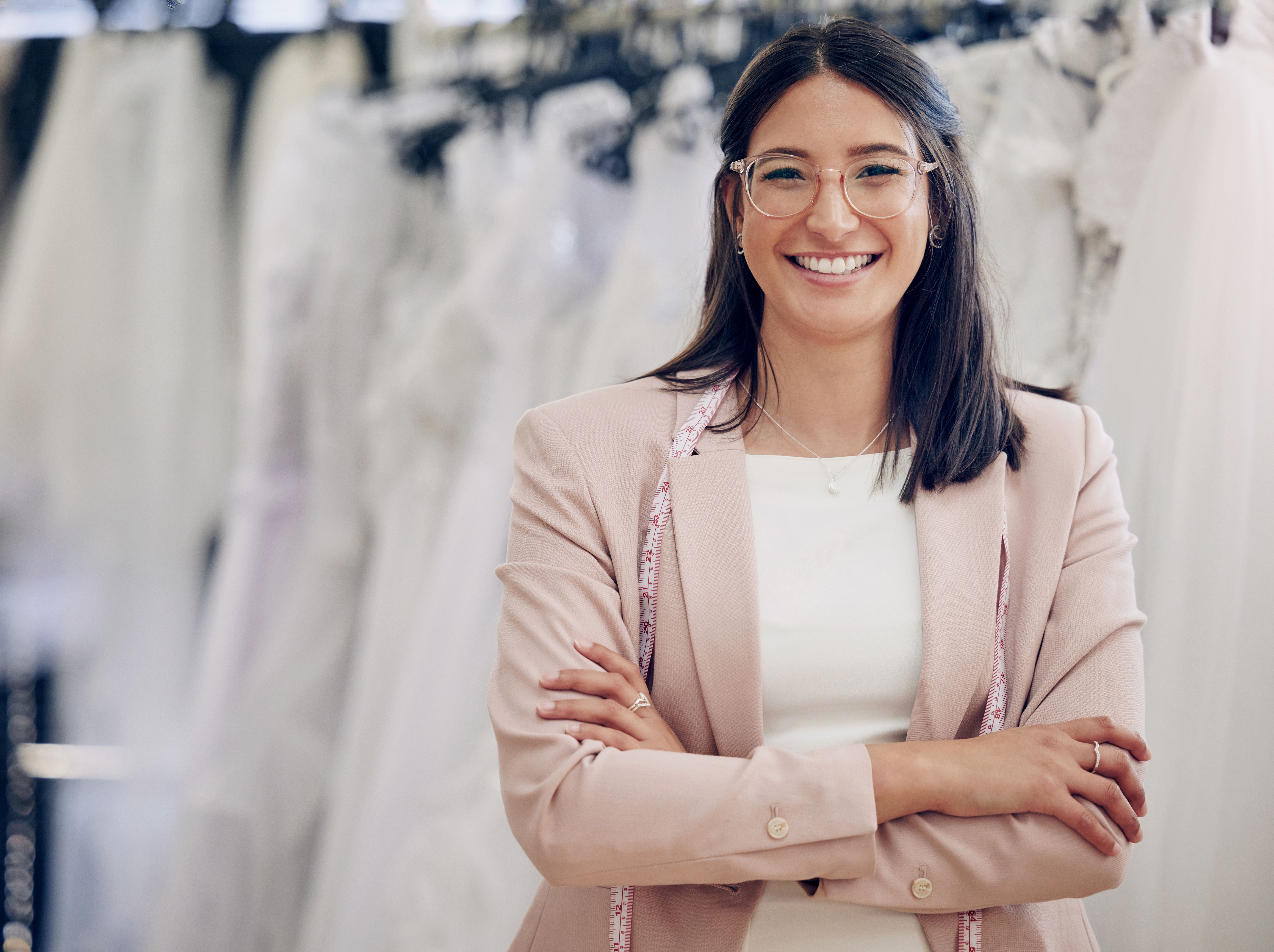 Wedding planner in front of dresses